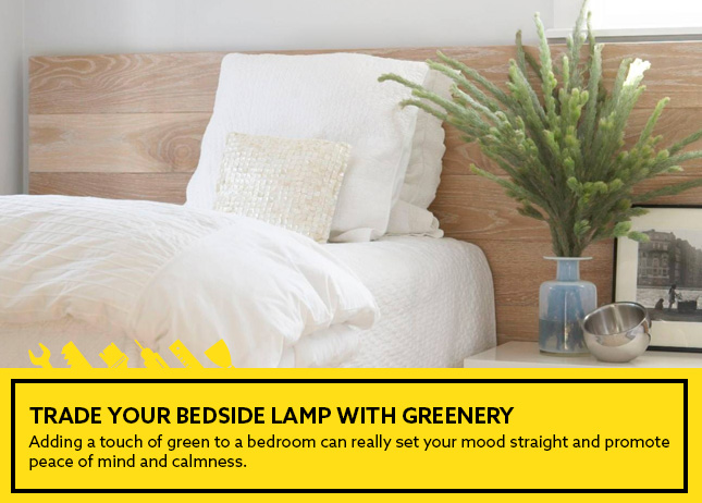 Trade your bedside lamp with greenery